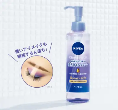 Nivea Cleansing Oil advertisement with eye makeup removal demonstration.
