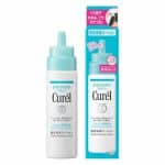 A 120ml dropper bottle of Curel Scalp Moisturizing Lotion beside its plastic packet.