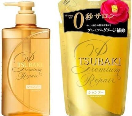 A 660ml refill packet of TSUBAKI Premium Repair Shampoo sealed in plastic packaging beside its pump bottle.