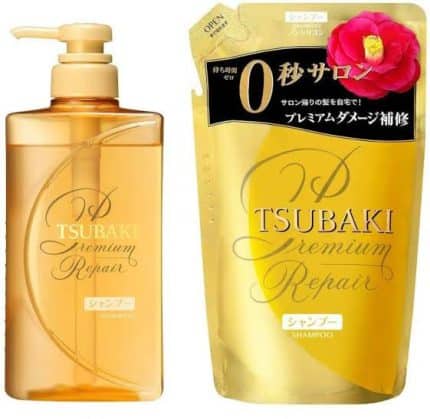 A 660ml refill packet of TSUBAKI Premium Repair Shampoo sealed in plastic packaging beside its pump bottle.