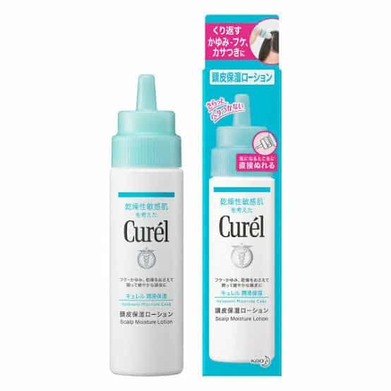 A 120ml dropper bottle of Curel Scalp Moisturizing Lotion beside its plastic packet.
